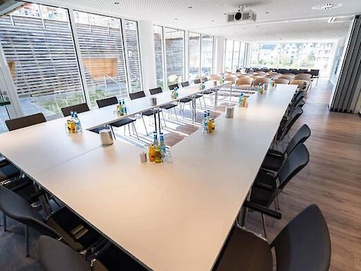 Meeting room with conference tables in U-shape